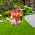 Bunnies and Basket Metal Art with Easter eggs and flowers on a lawn with garden.
