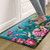 Springtime Hummingbirds Comfort Mat, vibrant floral design with hummingbirds, pink flowers on blue background.