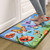 Sunshine Butterflies Comfort Mat with colorful butterflies and poppies on a blue and green background.