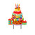 Multicolored metal art cake with gifts and candles on a stand with Happy Birthday text.