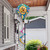 Happy Beehive Hot Air Balloon Spinner with colorful floral design and bee theme on a pole.