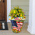 American Sunflowers Large Planter with vibrant flowers and patriotic American flag design on front porch.