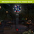 Patriotic Gnomes Illuminated Wind Chime with American flag design and gnomes, lit up at night.