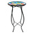 Black metal Fluttering Butterflies Plant Stand with colorful butterfly design on round table top surface.