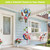 Floral Birdhouse Hot Air Balloon Spinner with colorful flowers and birdhouse design hanging from a porch.