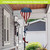 Wooden American Flag Hot Air Balloon Spinner outdoor decoration with red, white, and blue colors.
