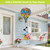Colorful Checkered Butterflies Hot Air Balloon Spinner with butterflies and flowers hanging from a porch ceiling.