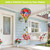 Garden Gerber Daisies Hot Air Balloon Spinner with colorful flowers and green spiral hanging outdoors.