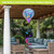 Dragonflies Hot Air Balloon Spinner outdoor decor with dragonflies design, blue and purple hues, patio setting.