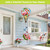 Flamingo Pair Hot Air Balloon Spinner with colorful flamingos and flowers hanging from a porch.