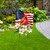 American Cardinal Metal Art garden flag with USA flag, red cardinal, and white flowers design.