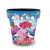 Vibrant medium planter with colorful geraniums, butterflies, and bird amidst pink, purple, and blue hydrangeas.
