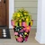 Spring Fling Large Planter with colorful floral design and vibrant flowers on a front porch.