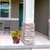 Spring Fling Medium Planter with vibrant floral design and bright flowers on a front porch.