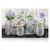 Large LED canvas art of checkered mason jars with white and purple flowers on a wooden backdrop.