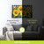 Large LED canvas art with checkered background and bright yellow sunflowers.