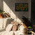 Large LED canvas art with checkered sunflowers in yellow and green on a black background.