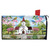 Church in Spring scene on mailbox cover with birds, flowers, and white picket fence.