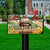 Farm Friends Mailbox Cover with cows, chickens, sunflowers and barns on a lawn with a house.