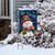 Friendly Winter Snowman Garden Flag with colorful scarf and hat on snowy display outdoors.