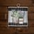Farmhouse Flowers Metal Mini Moment, 6-inch metal decor with vases and flowers on plaid background.