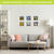 Sunflower Barn Metal Mini Moment decor on a living room wall with six colorful floral artworks.