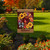 Harvest Wreath Garden Flag with sunflowers, cardinals, and plaid details on a garden lawn display.