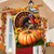 Wild Turkey and Pumpkins House Flag with colorful fall design and vibrant orange pumpkin display hanging outdoors.