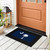Black South Carolina doormat with white palmetto tree and crescent on blue background outside orange door.