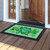 Green and white checkered Celebrate St. Patrick's Day doormat with shamrocks and black border.