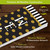 Briarwood Lane Checkerboard Pine Reversible Porch Leaner with gold polka dots and black stripes.