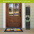 Welcome Wreaths Pine Reversible Porch Leaner with floral and HOME design on front door entrance.