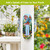 Spring Celebration Birdhouses Metal Thermometer with colorful floral design and bird scene on white porch post.