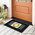 Black doormat with lemon wreath design on white and gray background, part of Lemon Wreath Mini Mat.