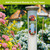 American Barn Metal Thermometer, metal pole with colorful barn and flower design, weather thermometer outdoors.