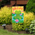 Peaceful Frog Garden Flag with green frog, pink flowers, and welcome text on colorful garden flag.