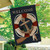 Coastal Anchor House Flag with nautical design, featuring a life preserver and paddle on a pole.