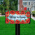 Bless This Home checkered mailbox cover with red poppies on green and blue background.