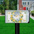 Bluebird Lemon Wreath Mailbox Cover with blue bird, lemons, and plaid bow design on grass.