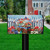 Patriotic Wagon Mailbox Cover with red, white, and blue flowers and American flag design.