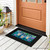 Be a Light To World Mini Mat on black doormat with colorful lantern design on porch.