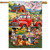 Farm Pups House Flag with colorful dogs, red truck, and flowers on green grass background.