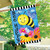Bee Happy Bumblebee House Flag with smiling bee, colorful flowers, and black and white stripes.