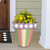Large Spring Stripes planter with colorful flowers, green, pink, beige, and purple striped ceramic pot.