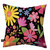 Vibrant floral pillow with pink, yellow, orange, and blue flowers on a black background.