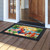 Happy Hour Parrot doormat with tropical design and colorful parrot on wooden porch outside doorway.