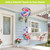 Butterflies and Peonies Hot Air Balloon Spinner with colorful flowers and butterflies hanging from porch.
