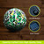 Green Leaves Solar LED Mosaic Gazing Ball with solar panels and on/off button, colorful leaf design.
