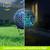 Geometric Blue Solar LED Glass Gazing Ball with mosaic pattern, on stand, daytime and nighttime view.