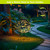 Organic purple and green solar LED glass gazing ball on stand in garden with warm yellow glow.